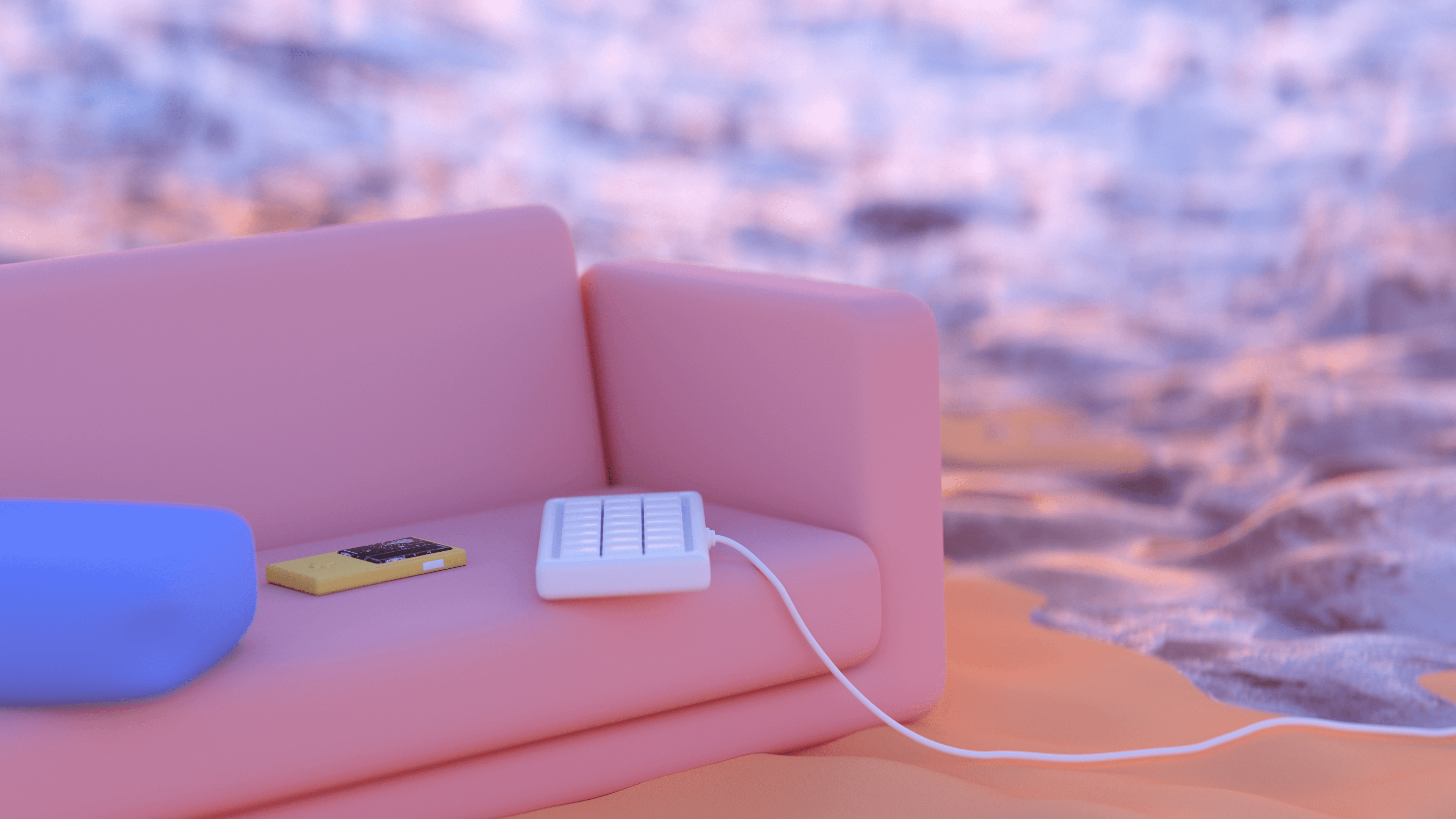 A cozy pink couch on a sandy beach with a gameboy and a keyboard on the cushion
